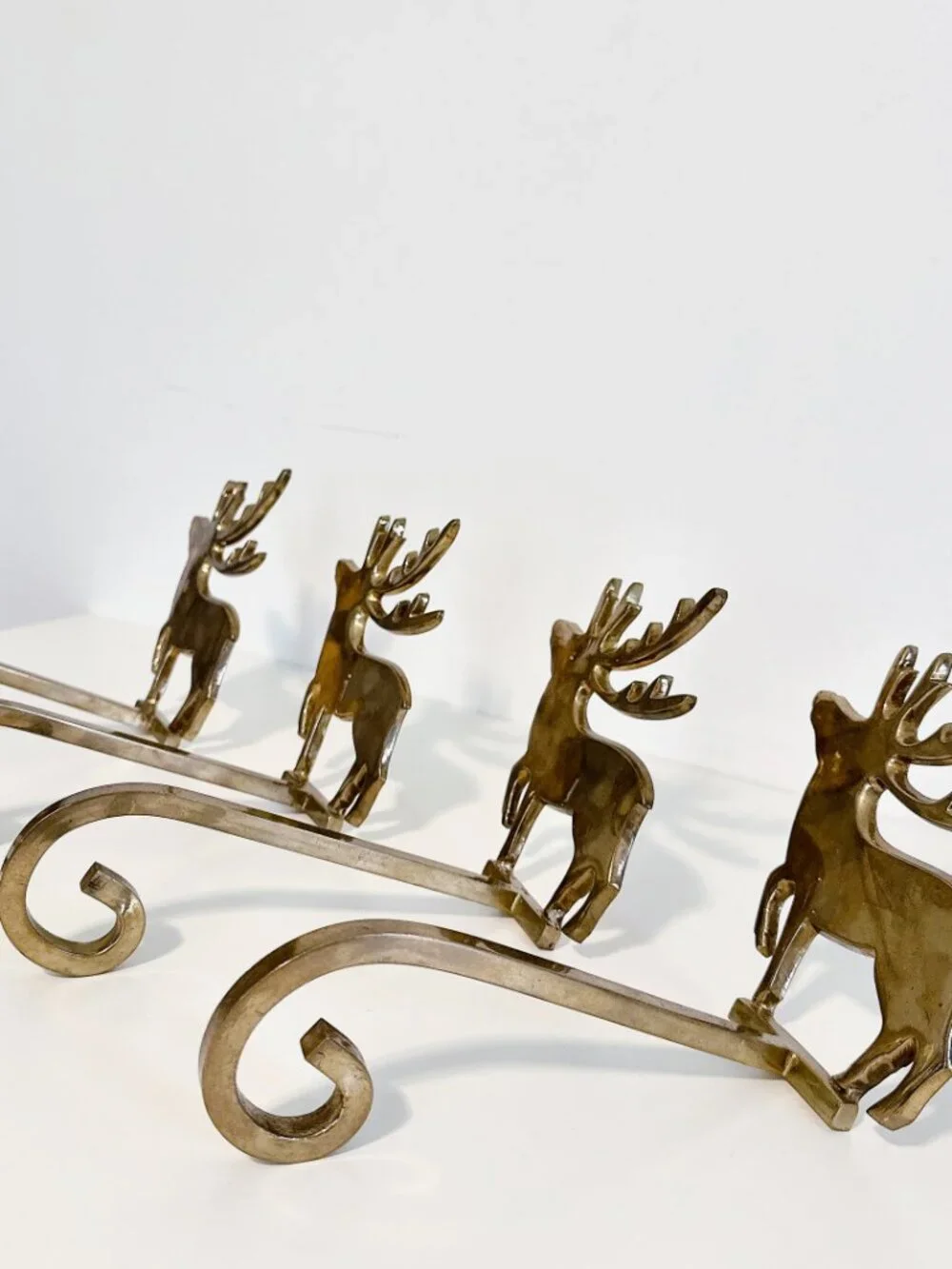 SET OF FOUR BRASS REINDEER MANTEL STOCKING HANGERS